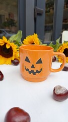 Orange Halloween Mug with Jack-o’-Lantern Face, Sunflowers and Chestnuts