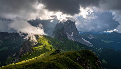 Fototapeta premium Mountain peaks piercing a dramatic sky