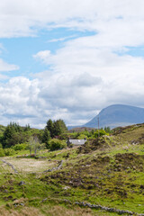Croft and cottage with a mountain in the background