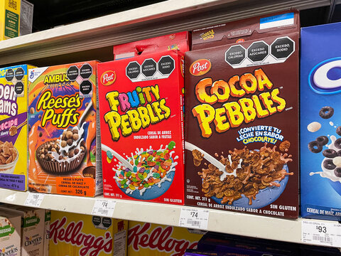 Cereal boxes on shelves in a supermarket, kelloggs, great value, post, nestle, quaker. Guadalajara, Mexico, March 30, 2024. Fruity Pebbles, Cocoa Pebbles