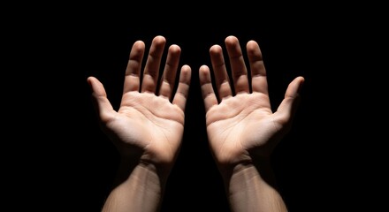 Two hands are presented against a black background