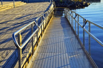 A ramp for swimming in the lake for people with disabilities, the disabled, and the elderly. Caring for people.