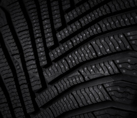 Macro texture of winter tire tread, automotive background for safety and design