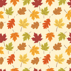 Autumn seamless pattern with multicolored orange, yellow, and brown leaves on a on a light beige background. Perfect for fall themed backgrounds, textile designs or wrapping paper. Vector Illustration