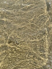 Sand and water textures with natural patterns and reflections. Minimalist beach backgrounds, perfect for summer design, eco projects, meditation apps, and abstract concepts.