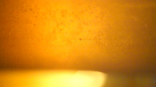 cold glass of beer macro slow motion