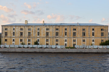 This Historic Building by the Riverbank shines at Sunset, creating an enchanting scene