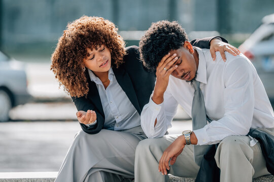 business people on the street with expressions of stress or trouble