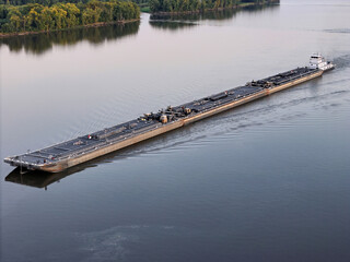 Set of liquid cargo barges being pushed North up the Mississippi River