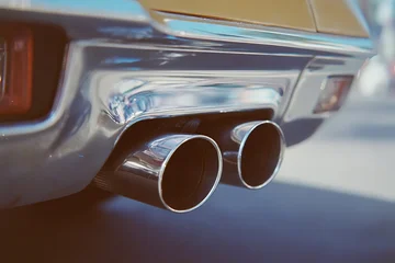Fotobehang Oldtimers Close-up of chrome exhaust pipes on classic car  © gabriel