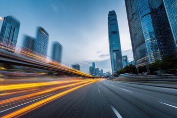 Fototapeta premium City street at dusk with motion blur of vehicles
