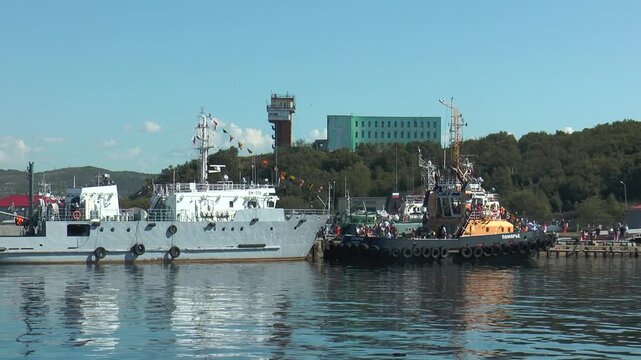 Severomorsk, RUSSIA - JULY 29, 2013. Day of the Navy of Russia. Near the pier there are small ships. 
