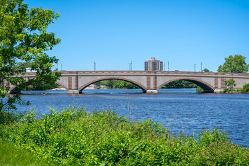 Historic Anderson Memorial Bridge connecting Cambridge and Boston over the tranquil Charles River in Massachusetts, USA

