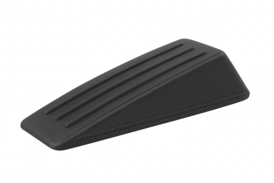 Black wedge rubber doorstop blocking open door