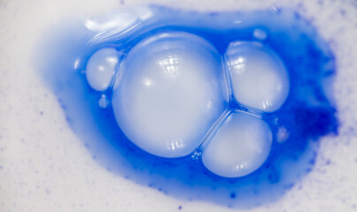 Close up of Blue Copper Peptides in Powder and Liquid Form