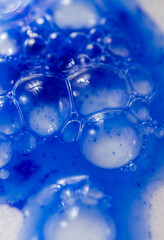 Close up of Blue Copper Peptides in Powder and Liquid Form