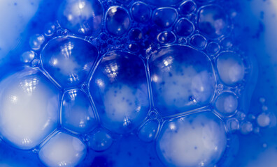 Close up of Blue Copper Peptides in Powder and Liquid Form