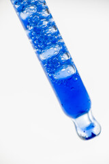 Close up of Blue Copper Peptides in Clear Pipette