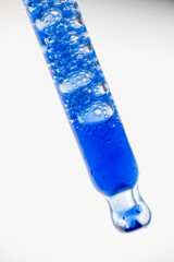 Close up of Blue Copper Peptides in Clear Pipette