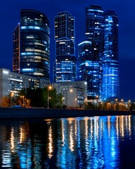 Nighttime Cityscape with Modern Skyscrapers Illuminated by Bright Neon Lights