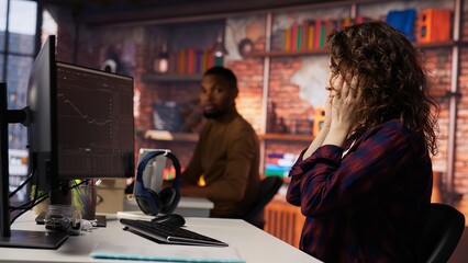 Startup manager delighted by successful IPO, watching live market updates showing stocks raising....