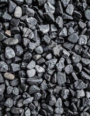 Close-up view of a textured surface of dark gray stones