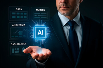 A businessman holding a glowing AI icon with a holographic data overlay. 