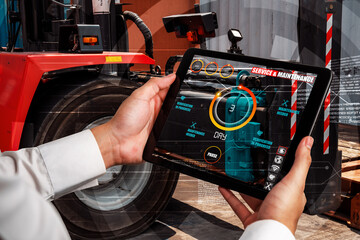 Engineer use augmented reality software in smart factory production line with automated application . Futuristic machinery in working in concept of Industry 4.0 or 4th industrial revolution.