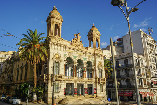 The Regional Theater of Oran on Place d'Armes Square with Historic Architecture and Palm Trees in Algeria