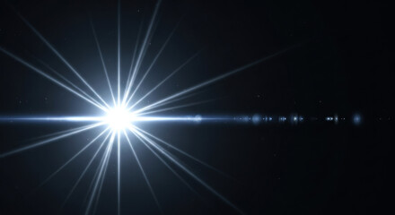 Fototapeta premium Luminous starburst with long light rays, glowing white flare on a black background