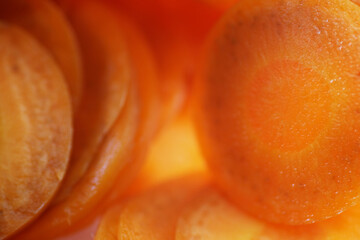 Close up shot of sliced carrot as background © taffpixture