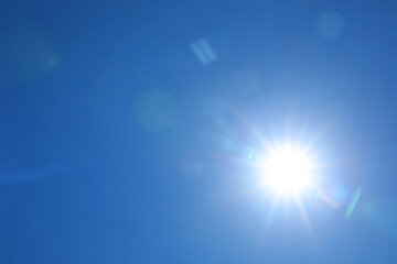 Fototapeta premium Bright sun on clear blue sky. Good weather
