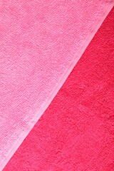 Bright terry towels as background, top view