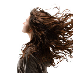 Naklejka premium Woman with long brown hair flowing in the wind, profile view against a transparent background. background removed