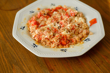 Stuffed red pointed peppers baked with meat inside and sweet cream ready to eat