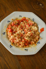 Stuffed red pointed peppers baked with meat inside and sweet cream ready to eat