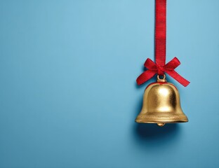 Gold bell with red ribbon on a light blue background