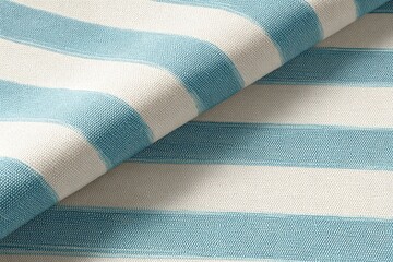 Close-up of light beige fabric with teal blue stripes
