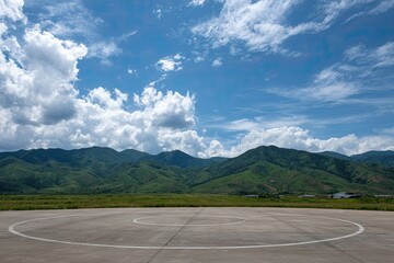 Empty helipad, mountains, sky