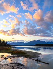Fototapeta premium Calm river at sunset with dramatic clouds