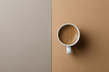 A cup of coffee on a color background