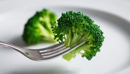 Broccoli florets on a fork