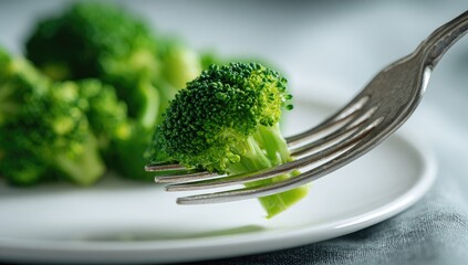 Fresh broccoli florets on a fork