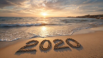 Sandy beach at sunset with 2020 written in the sand (1)
