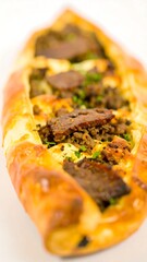 Turkish flatbread filled with meat and cheese