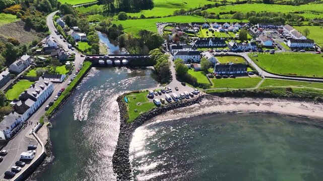 Aerial Drone shot of Cushendun village Glendun on the Irish Sea County Antrim Northern Ireland on a sunny day with a blue sky 