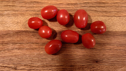 cherry tomatoes on wooden cutting board