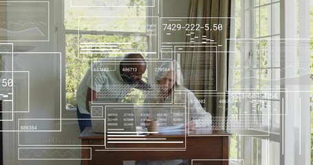 Man guiding woman through business data review with animated charts appearing at desk - Powered by Adobe