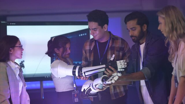 A team of biomedical engineers reviews a new bionic prosthetic, analyzing its myoelectric sensors and micro-actuators that allow for intuitive, lifelike movement and grip control.
