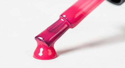 Pink nail polish dripping from applicator brush isolated PNG with Transparent Background